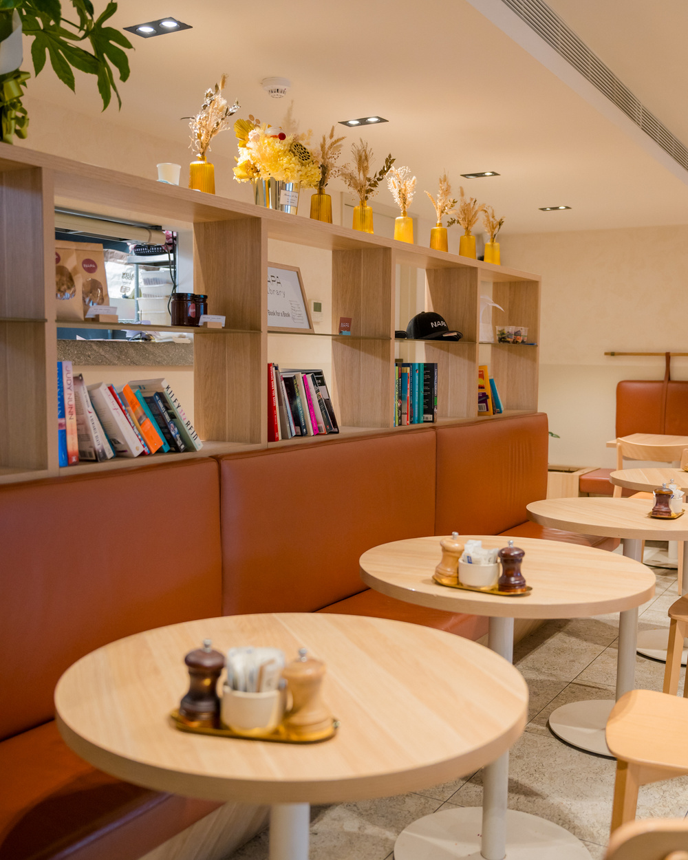 Some tables and a bookshelf in NAPA Cafe Glen Iris - setting the scene for ambiance.